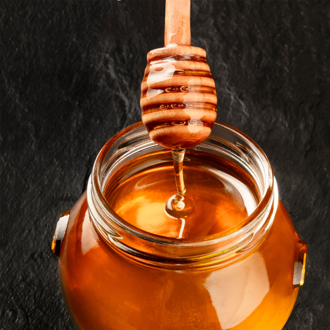 The Truth about forever liquid honey - amber honey dripping lusciously into honey jar