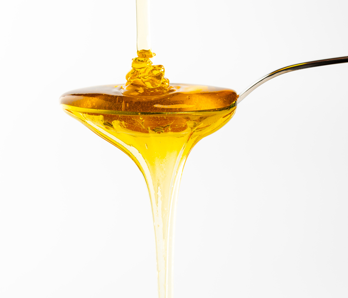 Spoon full of dripping honey